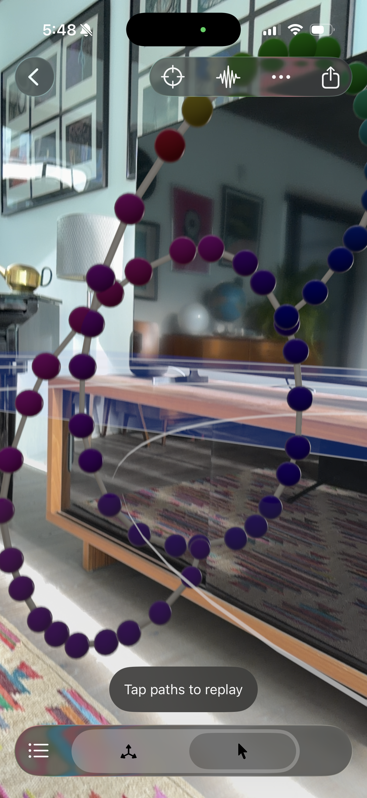 Replay mode showing colorful 3D paths floating in AR space